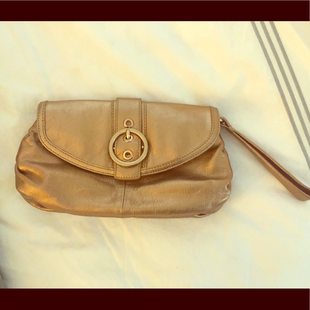Rose gold coach clutch with wrist strap